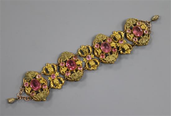 An ornate Victorian pinchbeck and pink paste set bracelet.